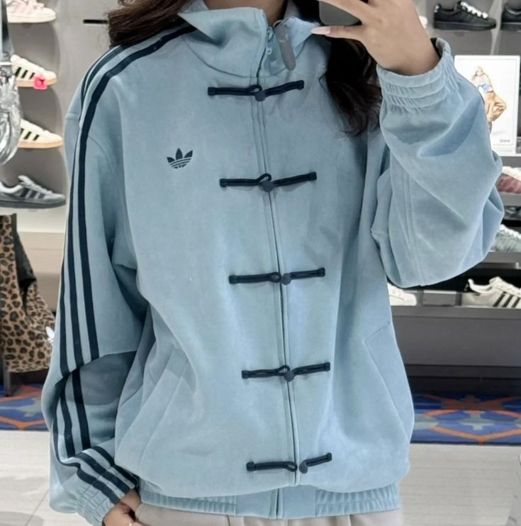 design of oversized aqua blue bomber, a premium alternative to the UNIQLO chinese New Year jacket