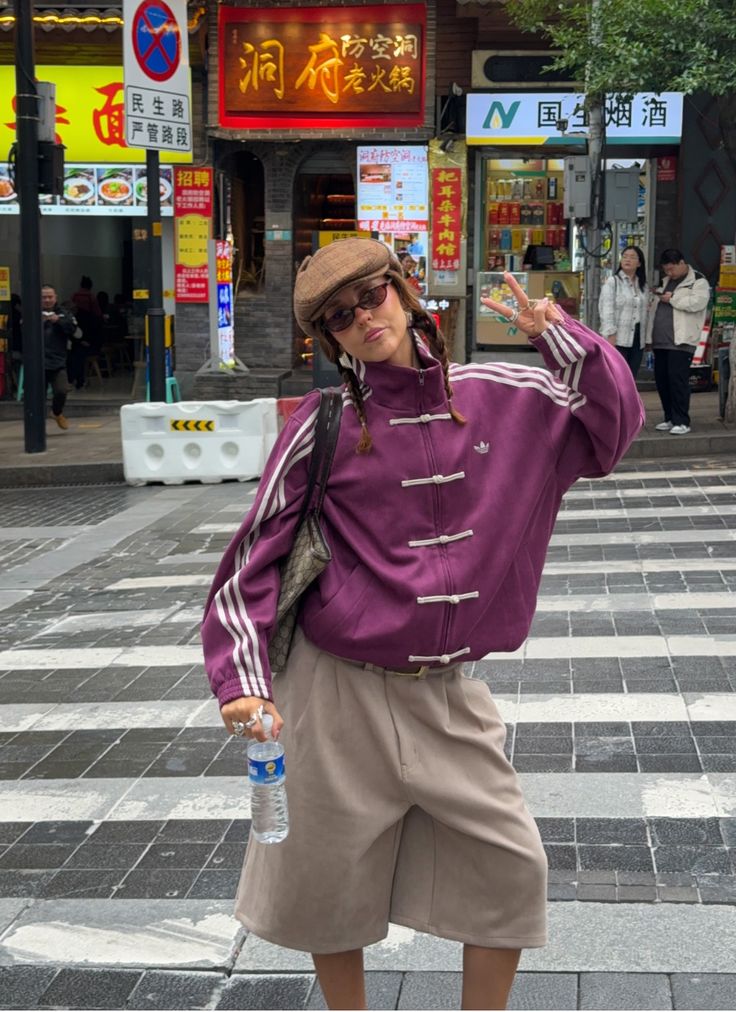 Front view of Uibok CNY jacket showing the oversized wine purple bomber design