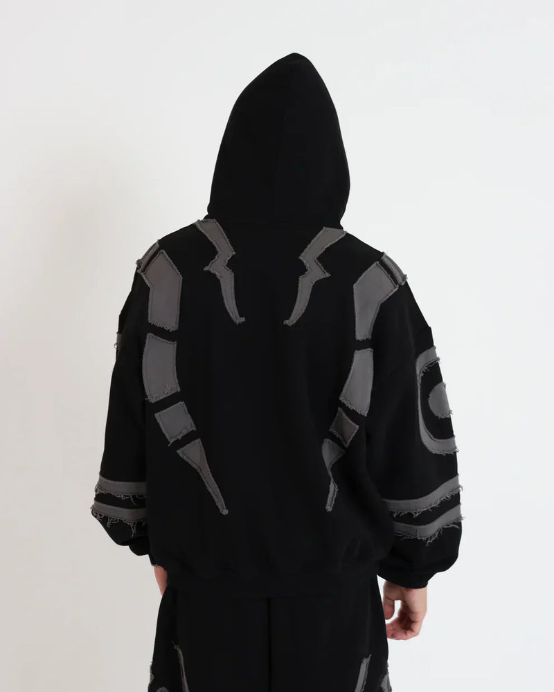 Men styling Uibok Ryomen Sukuna black oversized hoodie with dark streetwear aesthetic