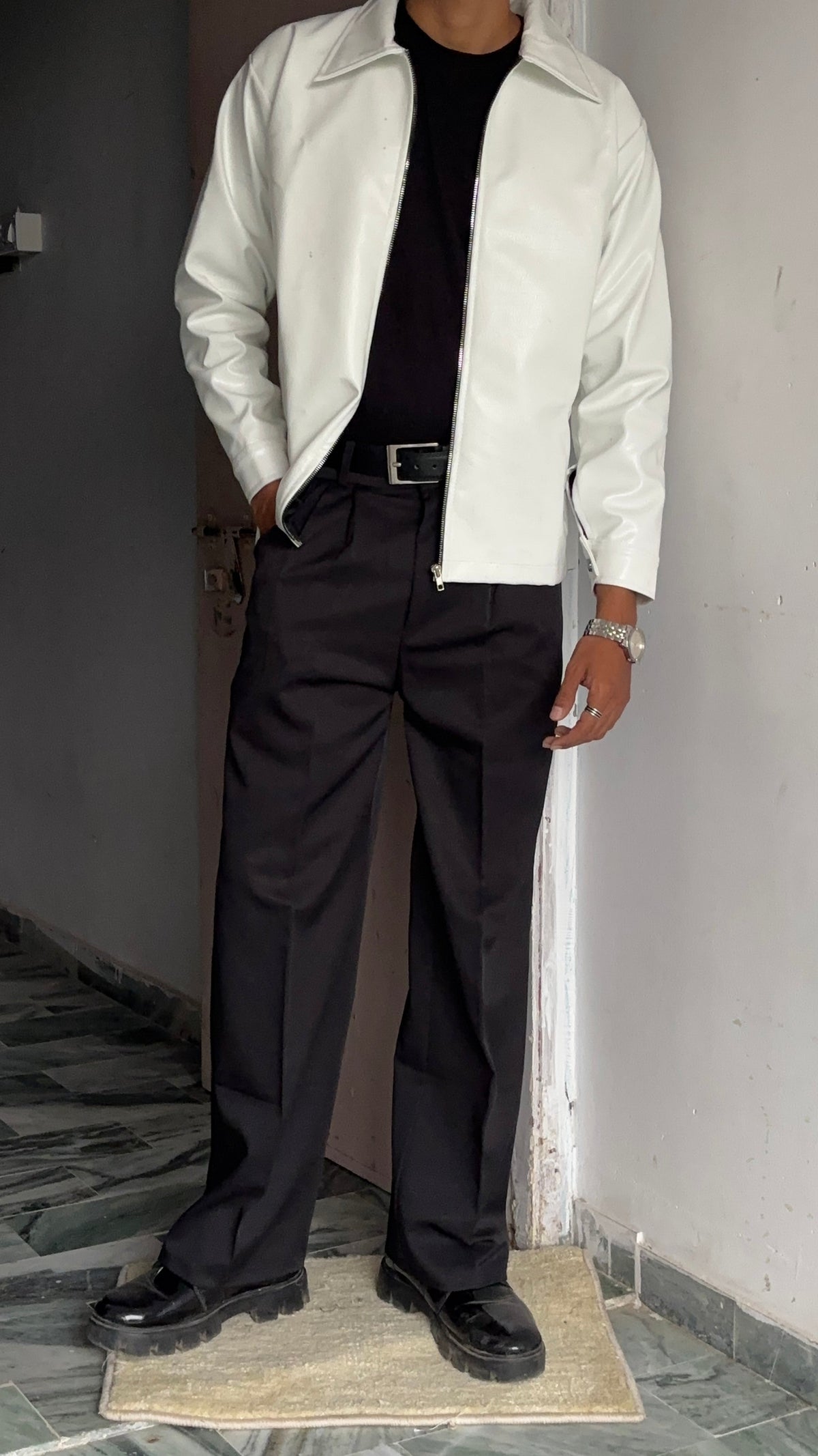 Model styling a White vegan leather jacket black, showing the perfect oversized faux black leather jacket mens/womens fit