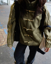 Showcasing the boxy relaxed fit of the Uibok Greens Lunar New Year outerwear