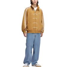 Showcasing the boxy relaxed fit of the Uibok yellow and Gold Lunar New Year outerwear