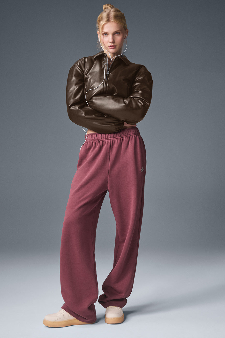 Side angle of uibok brown cropped leather jacket showing the oversized boxy fit