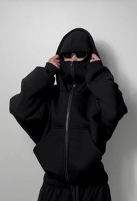 Urban streetwear oversized black hoodie with front zip, face covering, and sunglasses