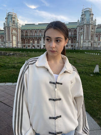 Uibok white CNY jacket with mandarin collar and frog closures for Indian and global streetwear