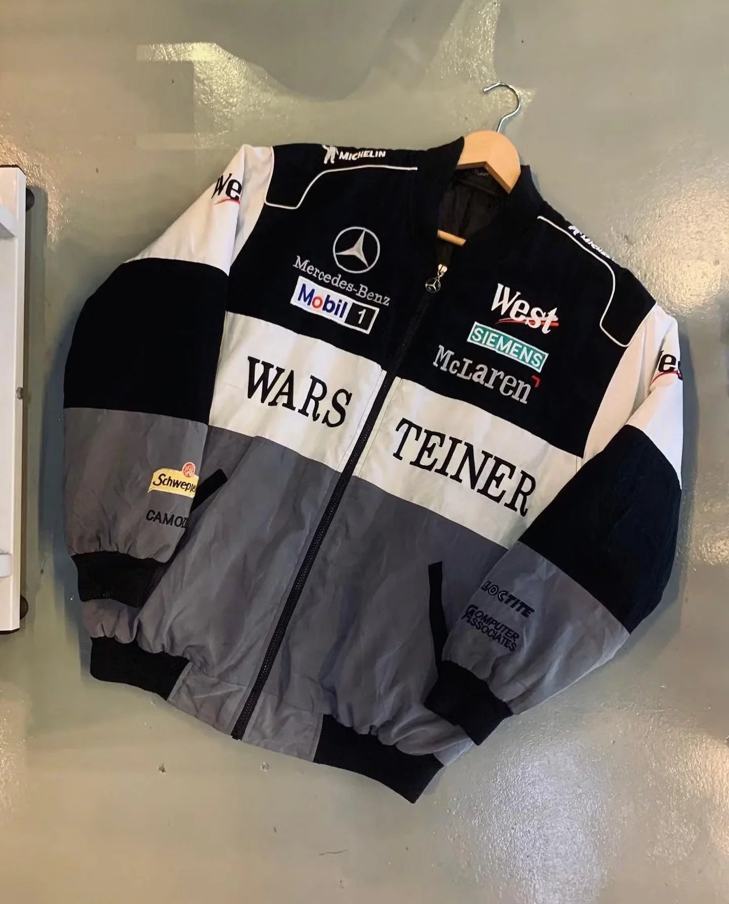 Retro McLaren printed jacket with bold motorsport logos and monochrome color blocks.